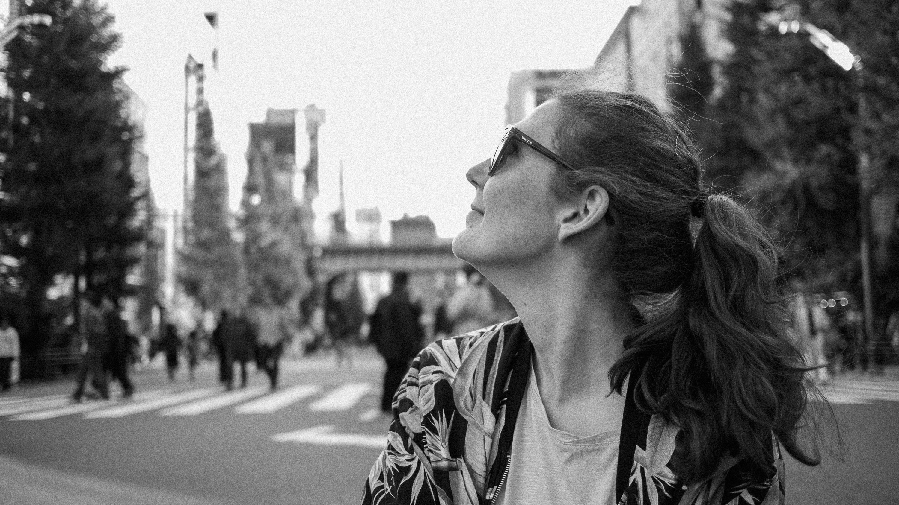 Black and white profile photo of a woman in tokyo.